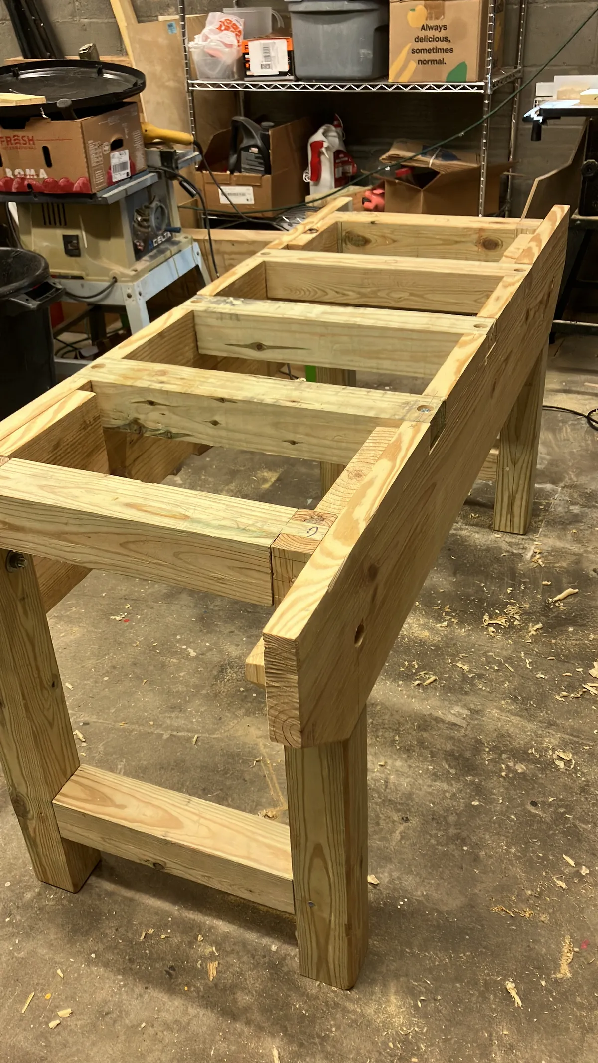 The H frames attached to the aprons and cross braces added